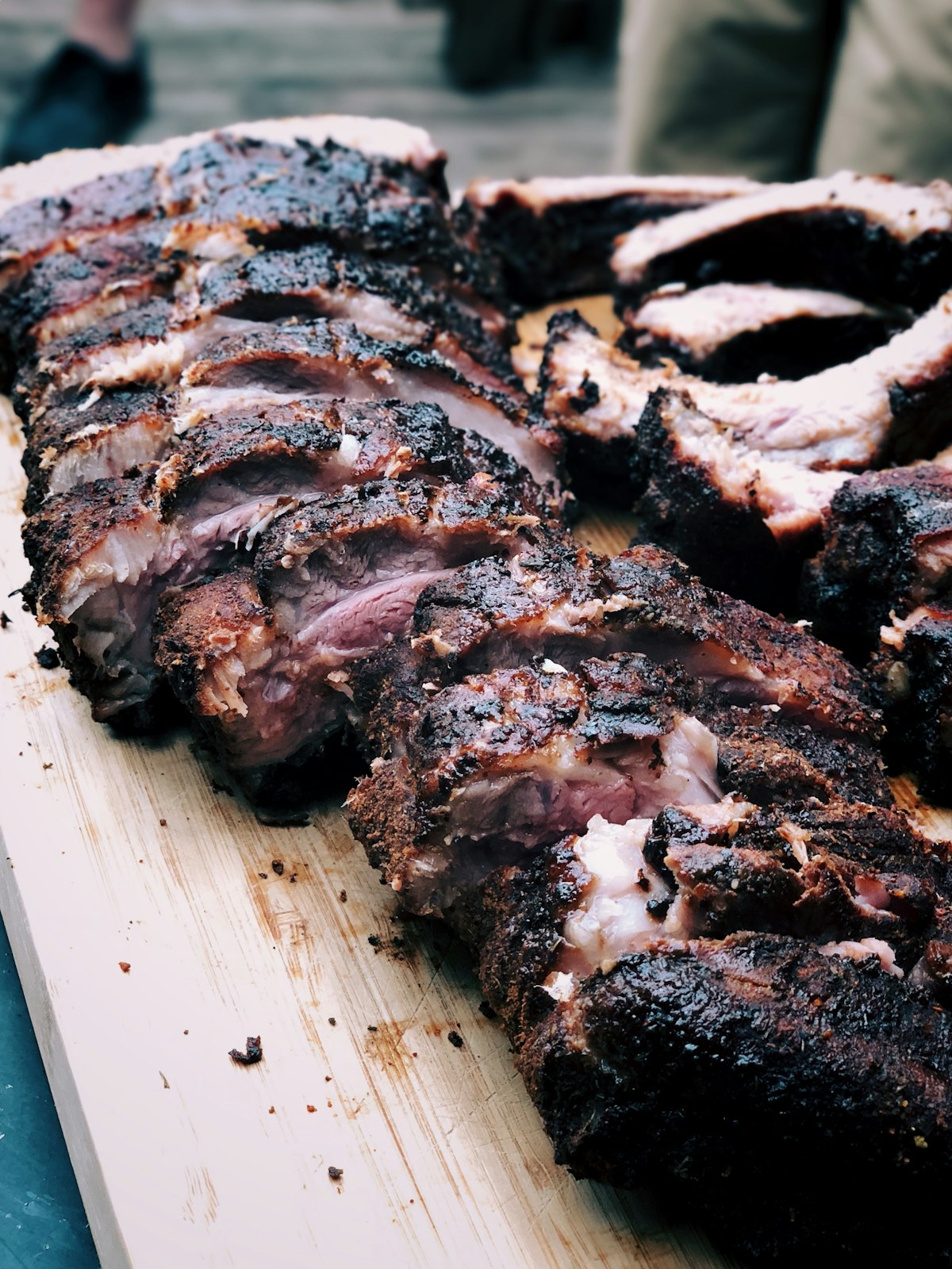 Charcoal grill with smoke rising over glowing embers